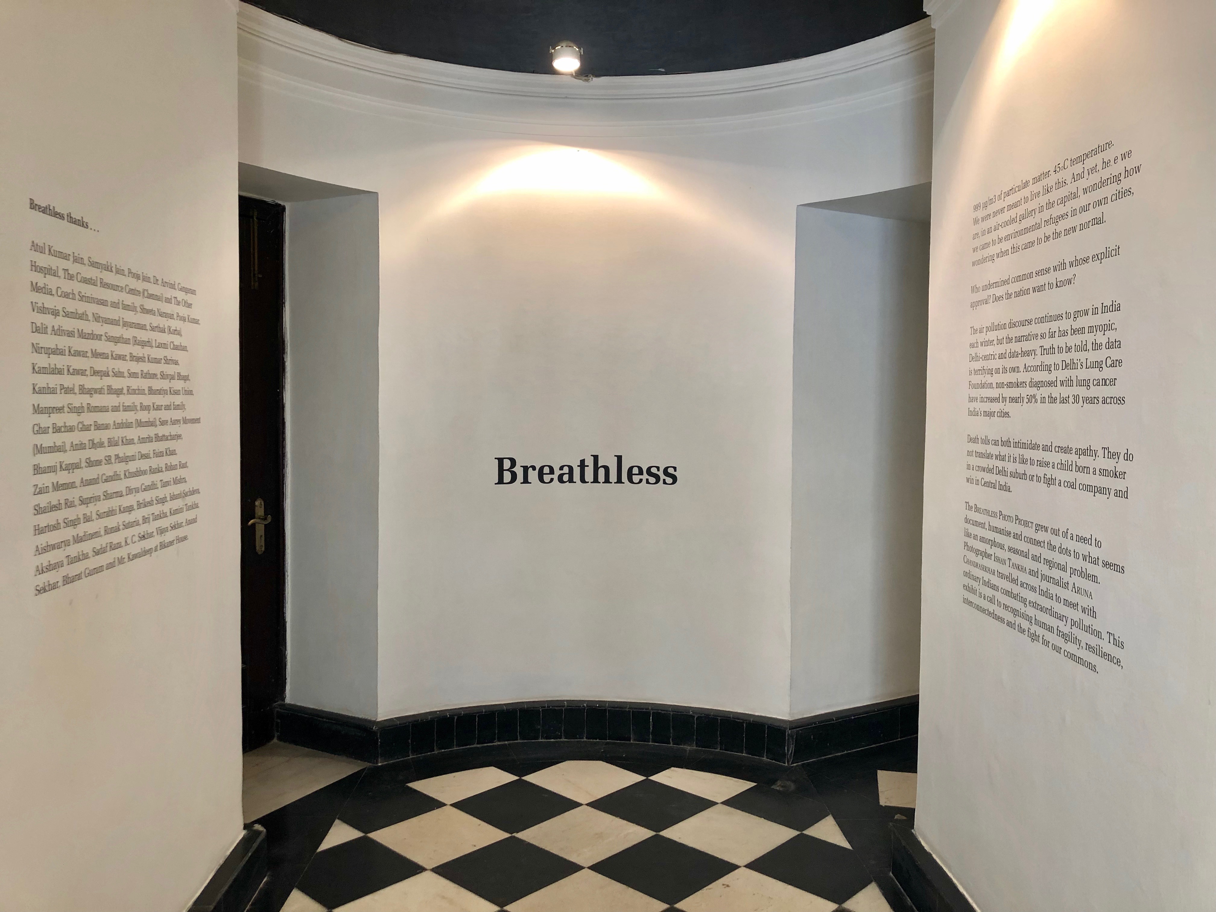 Hallway of a photo exhibit that reads "Breathless" 