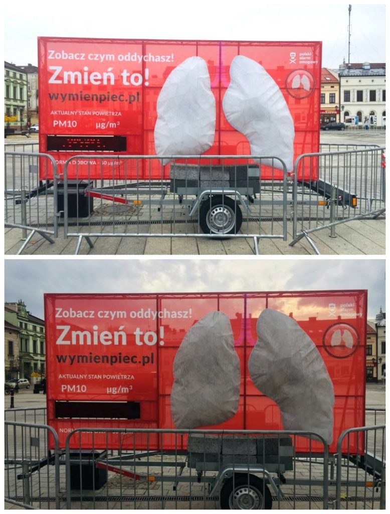 Image of two large billboard with lungs on them, one has an image of white lungs, and one is of black lungs, for an air pollution campaign